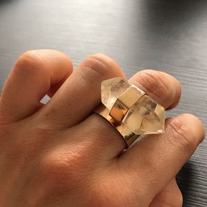Clear quartz crystal and gold plated ring